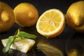 Half yellow lemons on a black with reflection , whole citrus, Basil, close up