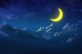 Half yellow moon behind cloudy on sky and star at night. Outdoor