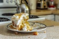 halfeaten cake with a fork resting on the plate sitting on kitchen counter