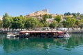 Halfeti, Sanliurfa/ Turkey- September 15 2020: Dam lake with touristic boats and restaurant and hill in background