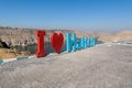 Halfeti, Sanliurfa/ Turkey- September 15 2020: I love Halfeti text sculpture and dam lake in background