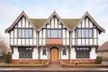 halftimbered tudor house with prominent diamond windows