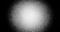 Halftone Dot Pattern Radiating from Center with Black and White Contrast dots texture Royalty Free Stock Photo