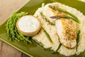 Halibut with asparagus risotto on green plate Royalty Free Stock Photo