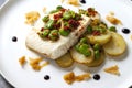 Halibut with baby potatoes, broad beans and chorizo Royalty Free Stock Photo