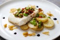 Halibut with baby potatoes, broad beans and chorizo Royalty Free Stock Photo