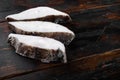 Halibut fish frozen steak, on old dark wooden table background, with copy space for text