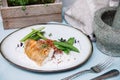 Halibut white fish in coconut sauce with ruby rice and blanched asparagus Royalty Free Stock Photo