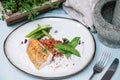 Halibut white fish in coconut sauce with ruby rice and blanched asparagus Royalty Free Stock Photo