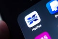 Halifax bank app seen on the edge of on the smartphone screen along with other banking apps