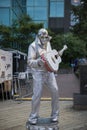 HALIFAX, NOVA SCOTIA, CANADA - 07 Aug 2023 : MIME artists posing as Elvis Presley statue at Halifax Waterfront. Performing stree