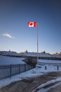 Halifax, Nova Scotia, Canada - 2022 JAN - Canadian Flag flying high at the entrance of Halifax Citadel Royalty Free Stock Photo