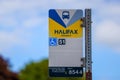 Halifax Transit bus stop information sign post with handicap access and stop number for tracking, Nova Scotia