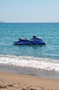 Blue sea and a jet ski floating on Aegean sea. Royalty Free Stock Photo