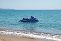 Blue sea and a jet ski floating on Aegean sea. Royalty Free Stock Photo