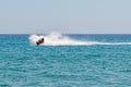 Blue sea and a jet ski floating on Aegean sea. Royalty Free Stock Photo