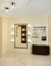 Hall in beige tones with hallstand and mirror Royalty Free Stock Photo