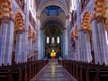 Inside the church hall of St Benno with aisle, benches and pillars Royalty Free Stock Photo