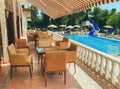 Hall in an expensive hotel on vacation. near the restaurant for the reception of guests swimming pool with sun loungers. in the Royalty Free Stock Photo