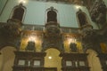 The Hall of Honor with walnut paneling, wallpapered with bas-reliefs.