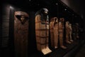 The Hall of Sarcophagi and other Egyptian objects displayed inside the Egyptian State Museum of Munich.