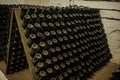 hall of white sparkling wine bottles in the winery cellar Royalty Free Stock Photo