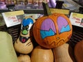 Hallloween Pumpkin Decoration in Supermarket Store, Real pumpkins with painted face as Halloween festival shopping concept