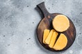 Halloumi sliced cheese on kitchen table. Gray background. Top view. Copy space Royalty Free Stock Photo