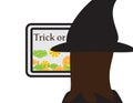 Online trick or treat, girl with witch hat looking at a screen with trick or treat text and candies Royalty Free Stock Photo