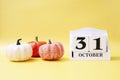 Halloween abstract concept. 31 october wooden calendar date sheldue, with autumn pumpkins.