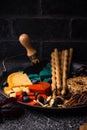 Halloween appetizers. Cheese plate with snacks