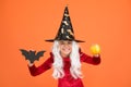 Halloween attributes. Little child in witch costume. Magical spell. Small witch with white hair. Wizard or magician Royalty Free Stock Photo