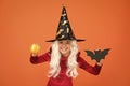 Halloween attributes. Little child in witch costume. Magical spell. Small witch with white hair. Wizard or magician Royalty Free Stock Photo
