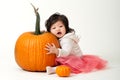 Halloween baby girl with pumpkins