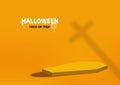 Halloween background. Abstract orange coffin shape with cross sign silhouette isolated on floor studio orange background. Royalty Free Stock Photo