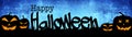 HALLOWEEN background banner wide panoramic panorama template -Silhouette of scary carved luminous cartoon pumpkins and isolated on Royalty Free Stock Photo