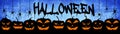 HALLOWEEN background banner wide panoramic panorama template -Silhouette of scary carved luminous cartoon pumpkins and spiders Royalty Free Stock Photo