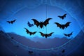 Halloween background with black bats, spider webs on blue background. Horrible background with space to copy your design Royalty Free Stock Photo