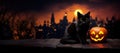 Halloween background with black cat, jack o lantern and city at night Royalty Free Stock Photo