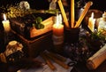 Halloween background with candles and magic objects