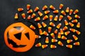 Halloween Background Candy corn candies, pumpkin basket. Traditional sweet Treats. Copy space Royalty Free Stock Photo