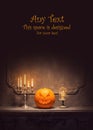 Halloween background with copy space for any text. Scary pumpkin and old skull on ancient gothic fireplace. Halloween Royalty Free Stock Photo