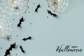 Halloween background with decorations from bats and spider webs with confetti and ribbon. Greeting card with text Happy halloween Royalty Free Stock Photo