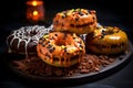 Halloween background, donuts, cheese and chocolate. On a black plate