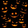 Halloween background with glowing pumpkin faces