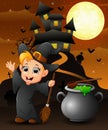 Halloween background with happy boy witch holding broomstick and cauldron Royalty Free Stock Photo