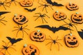 Halloween background. Modern pumpkins jack o lantern, spiders, bats layout on orange background. Happy Halloween festive pattern.