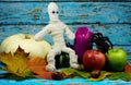 Halloween background with mummy,spider and autumn decoration