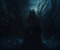 Halloween background. nightmarish silhouette of death in a cloak and a dark hood. Undead in a scary mystical forest. The