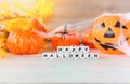 Halloween background orange with word blocks happy halloween decorations and pumpkin jack o lantern funny spooky spider web and Royalty Free Stock Photo